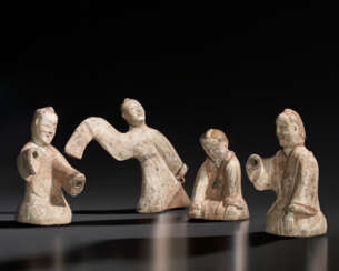 FOUR PAINTED POTTERY FIGURES OF PERFORMERS