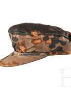 Militaria. A Camouflaged Visored Field Cap for Waffen SS Enlisted/NCO