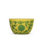 Collectibles. A FINE AND EXTREMELY RARE CARVED YELLOW-GROUND GREEN-ENAMELLED ‘LOTUS’ WINE CUP