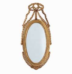 An Oval Louis XVI Mirror.