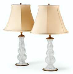 A NEAR PAIR OF GILT-METAL MOUNTED ITALIAN GLASS CANDLESTICKS, MOUNTED AS LAMPS