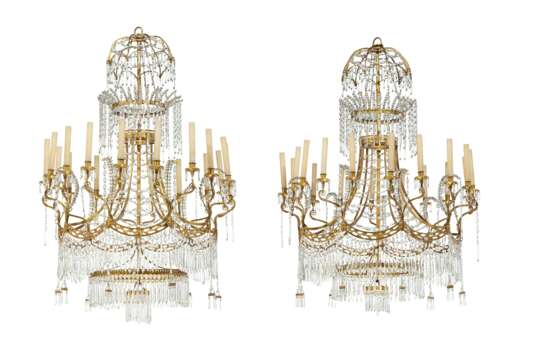 A PAIR OF NORTH EUROPEAN GILT-METAL AND CUT-GLASS EIGHTEEN-LIGHT CHANDELIERS - фото 1