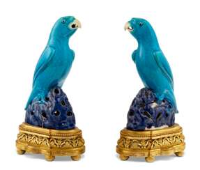 A PAIR OF ORMOLU-MOUNTED CHINESE TURQUOISE AND AUBERGINE GLAZED PARROTS