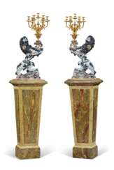 A MASSIVE PAIR OF GILT-METAL MOUNTED GALLE FAIENCE RAMPANT LION SEVEN-LIGHT CANDELABRA
