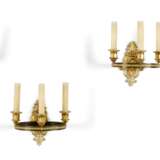 A SET OF FOUR EMPIRE ORMOLU AND PATINATED-BRONZE THREE-BRANCH WALL-LIGHTS - photo 1