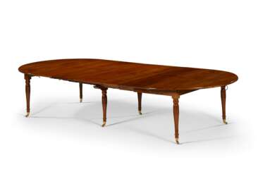 AN EMPIRE MAHOGANY EXTENSION DINING TABLE