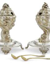 A PAIR OF FRENCH PARCEL-GILT SILVER FIGURAL MUSTARD POTS AND LINERS