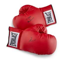 A PAIR OF BOXING GLOVES AUTOGRAPHED BY MUHAMMAD ALI