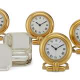 Cartier. A SET OF FOUR GILT-METAL TABLE CLOCKS AND A SET OF EIGHT SILVER RECEIVING TRAYS - photo 1