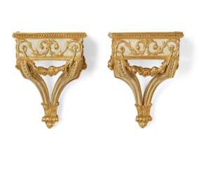 A PAIR OF FRENCH WHITE-PAINTED AND PARCEL-GILT WALL BRACKETS