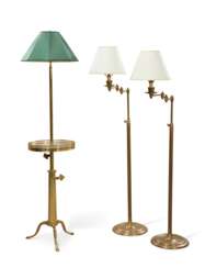 A GROUP OF THREE BRASS FLOOR LAMPS