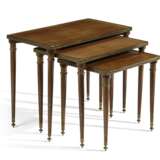 A SET OF THREE FRENCH BRASS-MOUNTED MAHOGANY NESTING TABLES - photo 1
