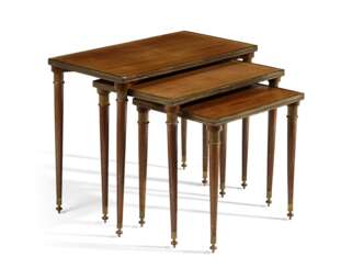 A SET OF THREE FRENCH BRASS-MOUNTED MAHOGANY NESTING TABLES