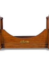 H.R.H. THE PRINCESS MARGARET, COUNTESS OF SNOWDON'S EMPIRE LIT EN BATEAU FROM APARTMENT 1A KENSINGTON PALACE:AN EMPIRE ORMOLU-MOUNTED MAHOGANY LIT EN BATEAU