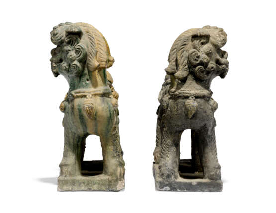 TWO CHINESE BISCUIT-GLAZED FAMILLE VERTE BUDDHIST LIONS AND A PAIR OF POLYCHROME STONE LIONS - photo 2