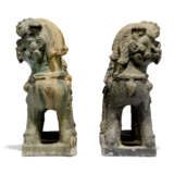 TWO CHINESE BISCUIT-GLAZED FAMILLE VERTE BUDDHIST LIONS AND A PAIR OF POLYCHROME STONE LIONS - фото 2