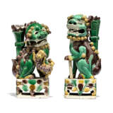 TWO CHINESE BISCUIT-GLAZED FAMILLE VERTE BUDDHIST LIONS AND A PAIR OF POLYCHROME STONE LIONS - фото 6