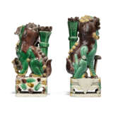 TWO CHINESE BISCUIT-GLAZED FAMILLE VERTE BUDDHIST LIONS AND A PAIR OF POLYCHROME STONE LIONS - photo 7