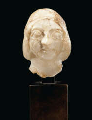 A SUMERIAN GYPSUM FEMALE HEAD