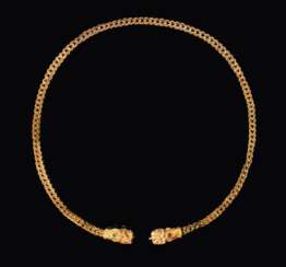 A SARMATION GOLD AND GLASS NECKLACE WITH LION-HEAD TERMINALS...