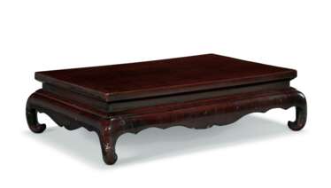 A CHINESE BROWN LACQUER KANG TABLE
