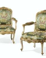 A PAIR OF LOUIS XV WHITE-PAINTED AND PARCEL-GILT FAUTEUILS
