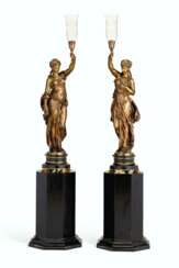 A PAIR OF FRENCH PATINATED-BRONZE FIGURAL TORCHERES, ON PEDESTALS