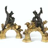 A PAIR OF FRENCH ORMOLU AND PATINATED BRONZE CHENETS - photo 1