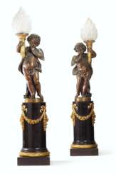 A PAIR OF LARGE FRENCH ORMOLU AND PATINATED BRONZE FIGURAL TORCHERES, ON STANDS