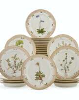 TWENTY-FOUR ROYAL COPENHAGEN PORCELAIN ‘FLORA DANICA’ BREAD AND BUTTER PLATES