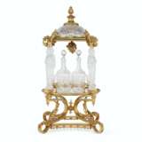 A FRENCH ORMOLU-MOUNTED CUT AND MOLDED GLASS TANTALUS - photo 1