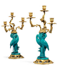 A PAIR OF ORMOLU-MOUNTED CHINESE TURQUOISE-GROUND PORCELAIN THREE-LIGHT CANDELABRA