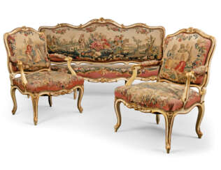A LOUIS XV WHITE-PAINTED AND PARCEL-GILT SUITE OF SEAT FURNITURE COVERED IN CONTEMPORARY BEAUVAIS TAPESTRY 