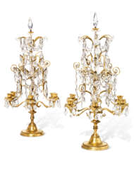 A PAIR OF FRENCH ORMOLU AND CUT AND MOULDED-GLASS SIX-LIGHT CANDELABRA