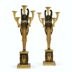 A PAIR OF EMPIRE ORMOLU AND PATINATED BRONZE FIVE-LIGHT CANDELABRA