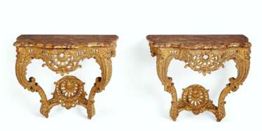 A NEAR PAIR OF EARLY LOUIS XV GILTWOOD CONSOLES