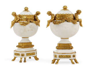 A PAIR OF FRENCH ORMOLU-MOUNTED MARBLE URNS