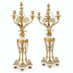A PAIR OF FRENCH ORMOLU-MOUNTED WHITE MARBLE THREE-LIGHT CANDELABRA
