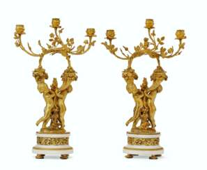 A PAIR OF FRENCH ORMOLU AND WHITE MARBLE FIGURAL THREE-LIGHT CANDELABRA