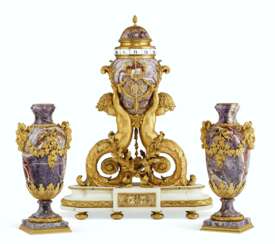 A FINE FRENCH ORMOLU-MOUNTED AMETHYST AND WHITE MARBLE THREE-PIECE CLOCK GARNITURE