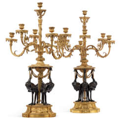 A PAIR OF FRENCH ORMOLU AND PATINATED BRONZE SEVEN-LIGHT CANDELABRA