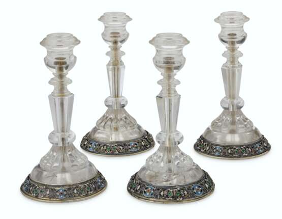 A SET OF FOUR AUSTRIAN SILVER-GILT AND ENAMEL-MOUNTED ROCK CRYSTAL CANDLESTICKS - photo 1
