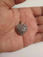 Beautiful silver pendant in the form of a heart