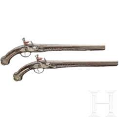 A pair of silver-mounted flintlock oriental pistols, Ottoman, around 1820/30