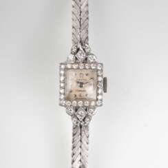 Omega gegründet 1848 in La Chaux-de-Fonds. Vintage Damen-Armbanduhr mit Brillant-Besatz von Türler