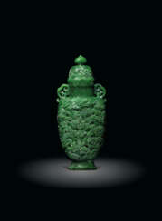 A FINELY CARVED SPINACH-GREEN JADE 'LANDSCAPE' VASE AND COVE...