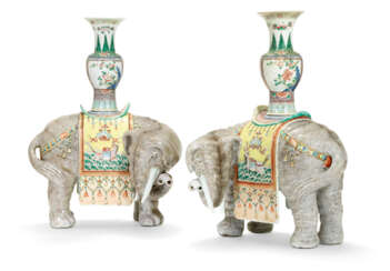 A LARGE PAIR OF FAMILLE ROSE CAPARISONED ELEPHANTS