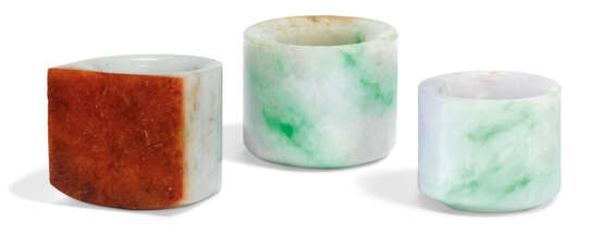 A GROUP OF THREE JADEITE ARCHER'S RINGS - photo 1