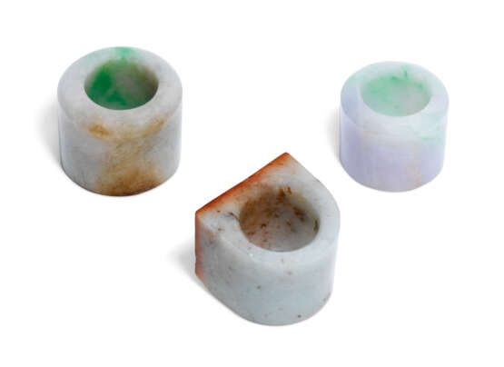 A GROUP OF THREE JADEITE ARCHER'S RINGS - photo 2