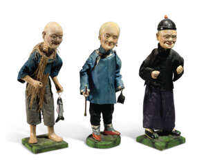 A SET OF THREE PAINTED CLAY CHINESE EXPORT FIGURES